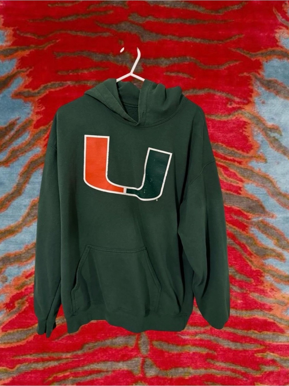 Green Hoodie with Orange & White 'U' Graphic